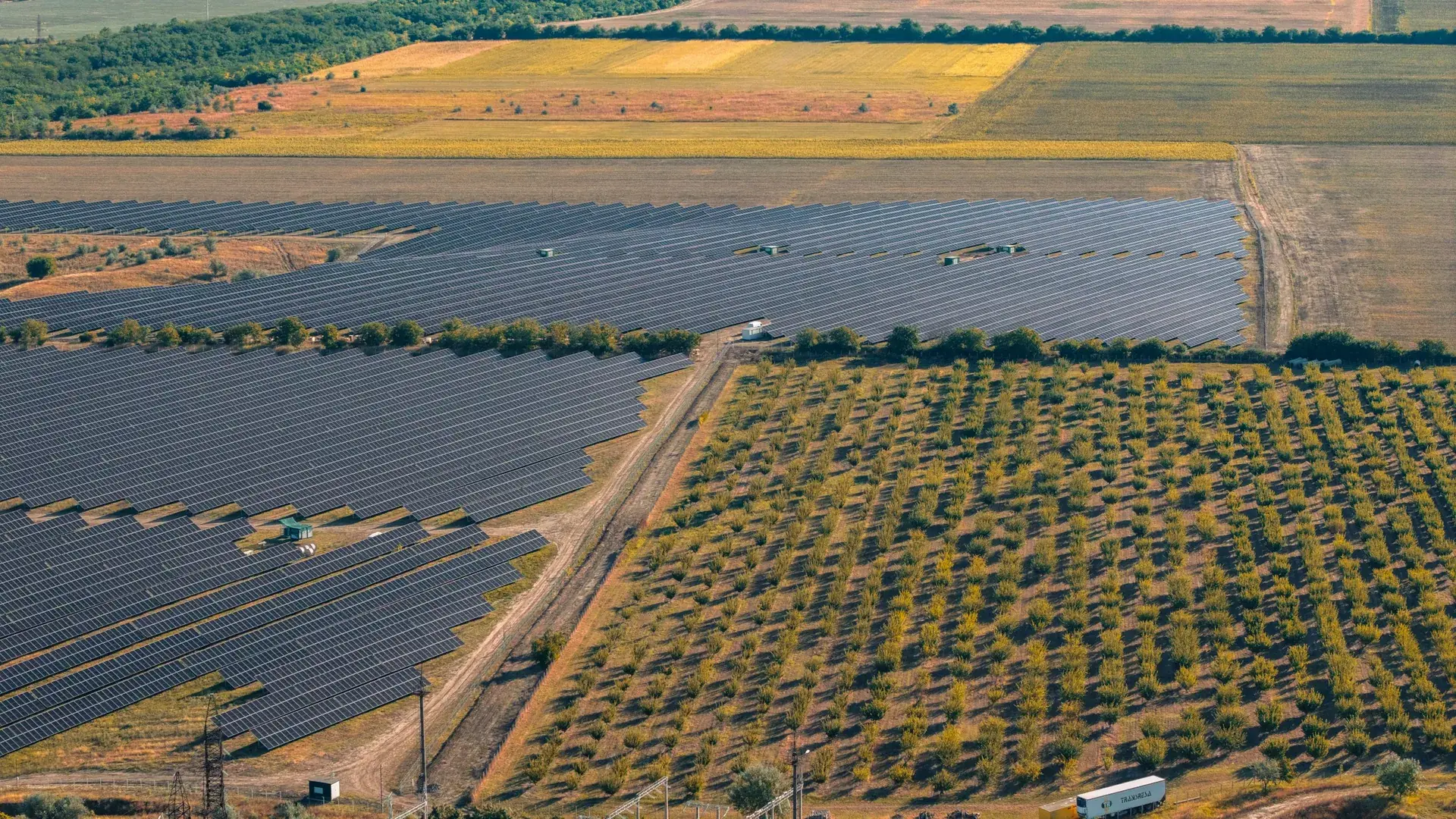 Aerial view of a solar energy site beside agricultural land